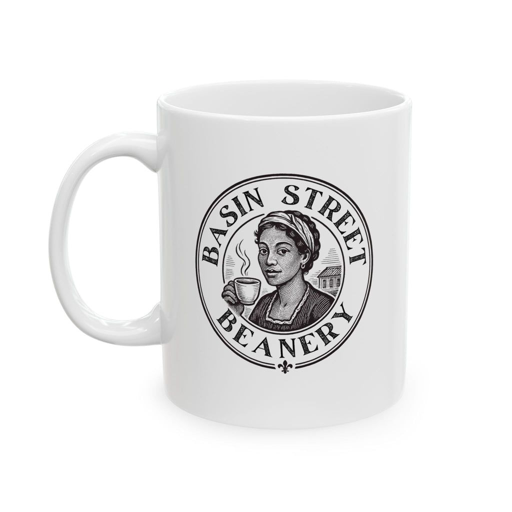 White mug with Basin Street Beanery logo featuring a woman holding a coffee cup on a white background