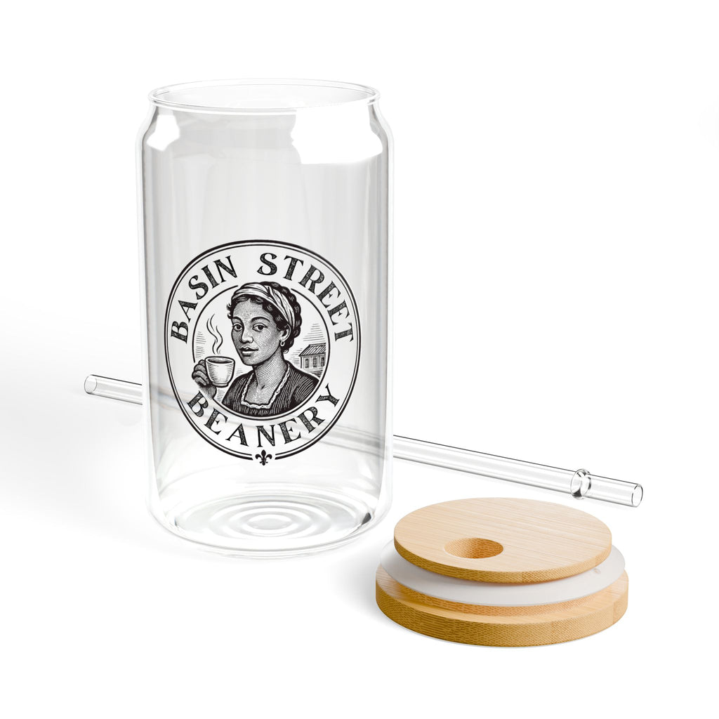 Glass jar with 'Basin Street Beaner' logo, wooden lid, and straw on a white background