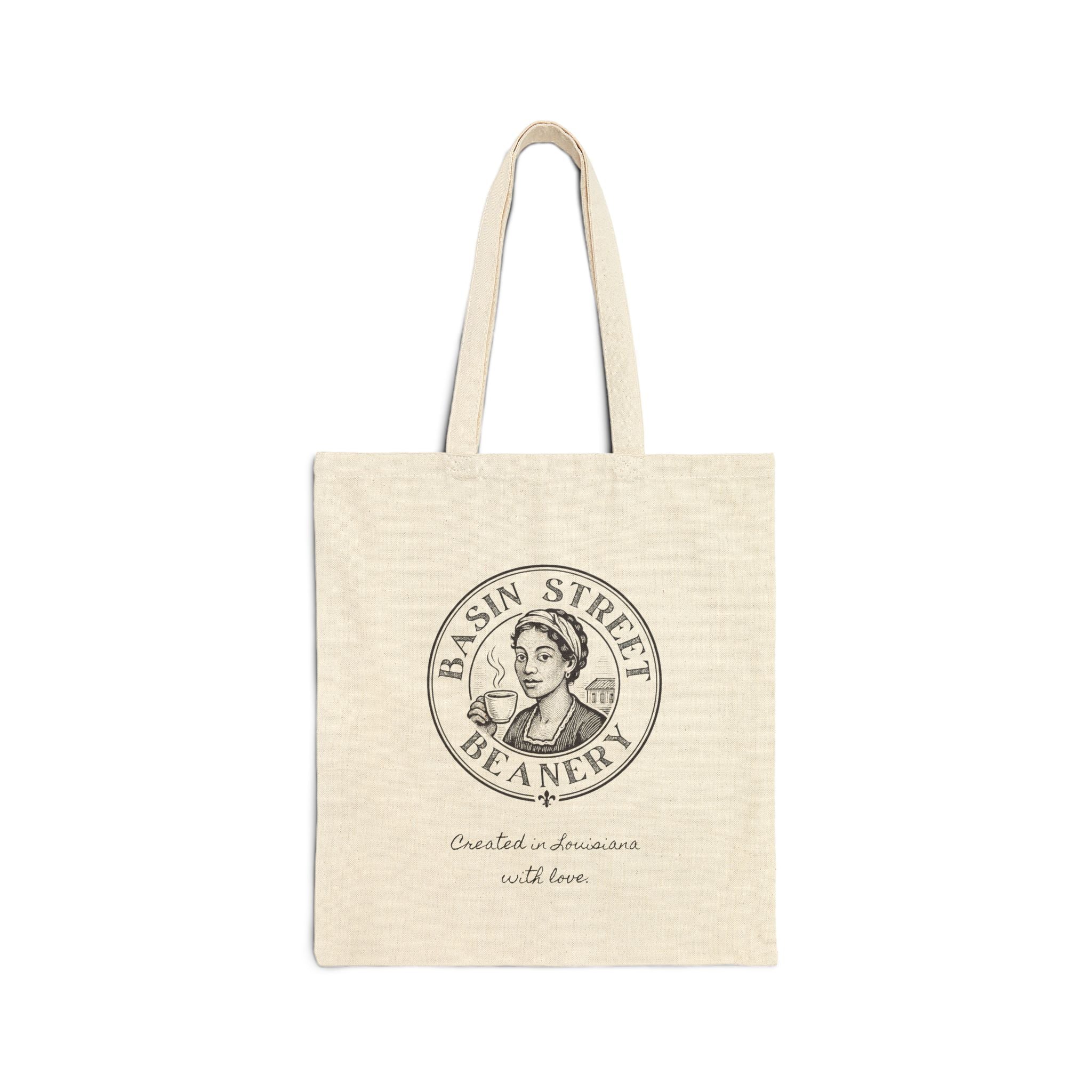 Beige tote bag with 'Basin Street Beanery' logo on a white background